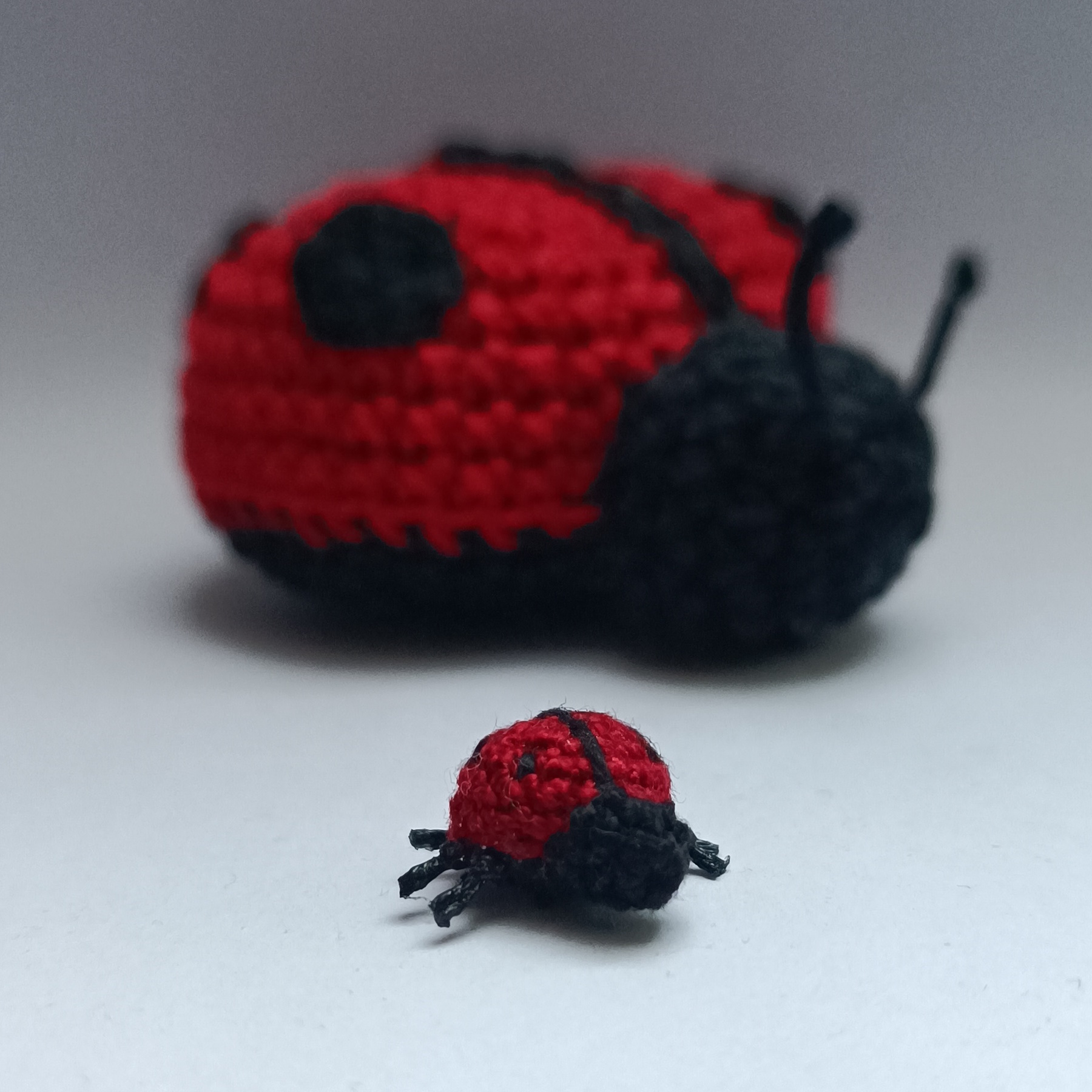 Micro crochet LadyBug amigurumi compared with a bigger size